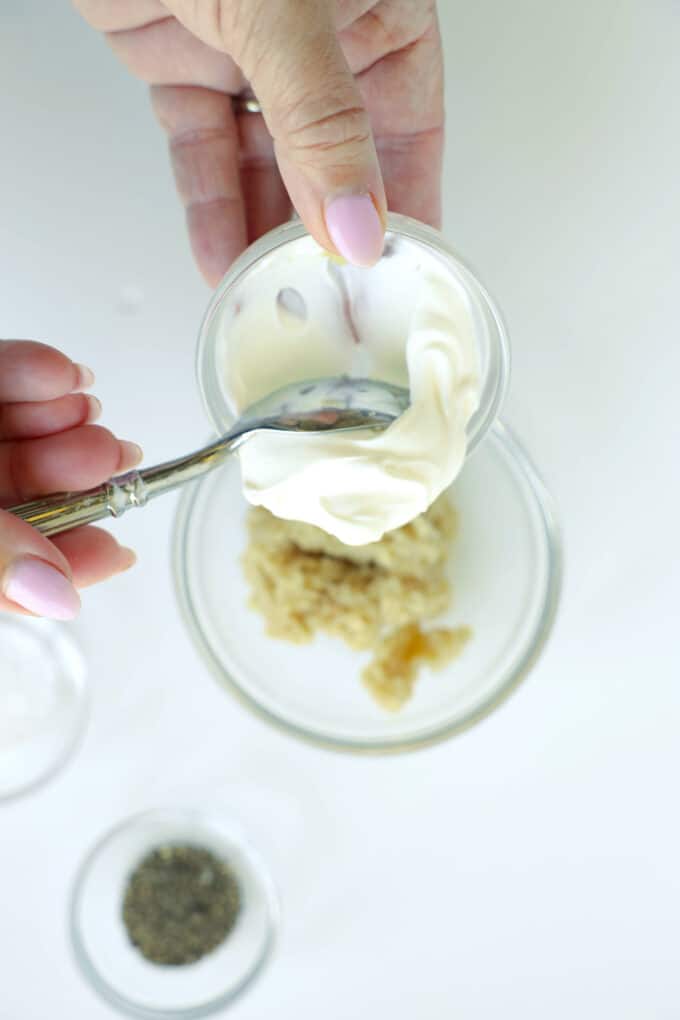 Adding sour cream to prepared horseradish for homemade horseradish sauce