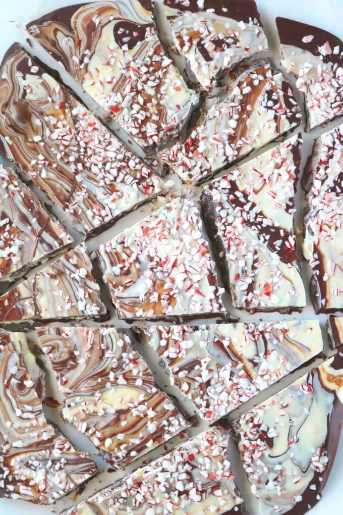 An overhead shot of chocolate peppermint bark broken into bite size pieces. 