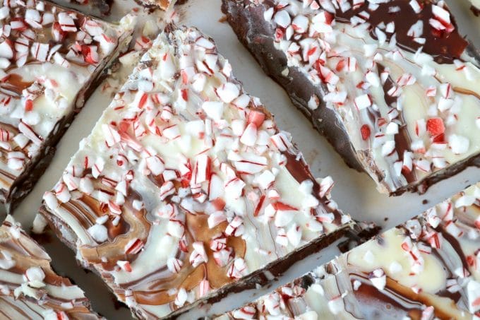 A close up shot of chocolate Peppermint Bark broken into small bite size pieces. 