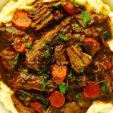 Dutch oven pot roast over mashed potatoes