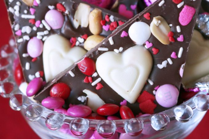 Several pieces of Peanut Butter Lovers Chocolate Bark in a clear beaded glass bowl. 
