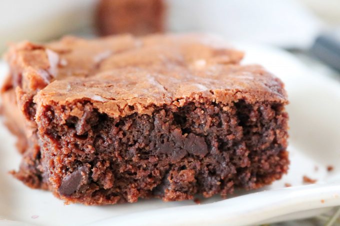 A slice of Chocolate Brownies served on a white plate. 