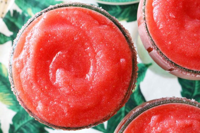 An overhead shot of frozen strawberry margaritas. 