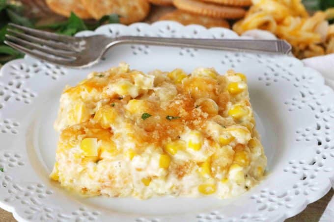 Cream Corn Casserole with Cream Cheese on a plate with a fork behind it.