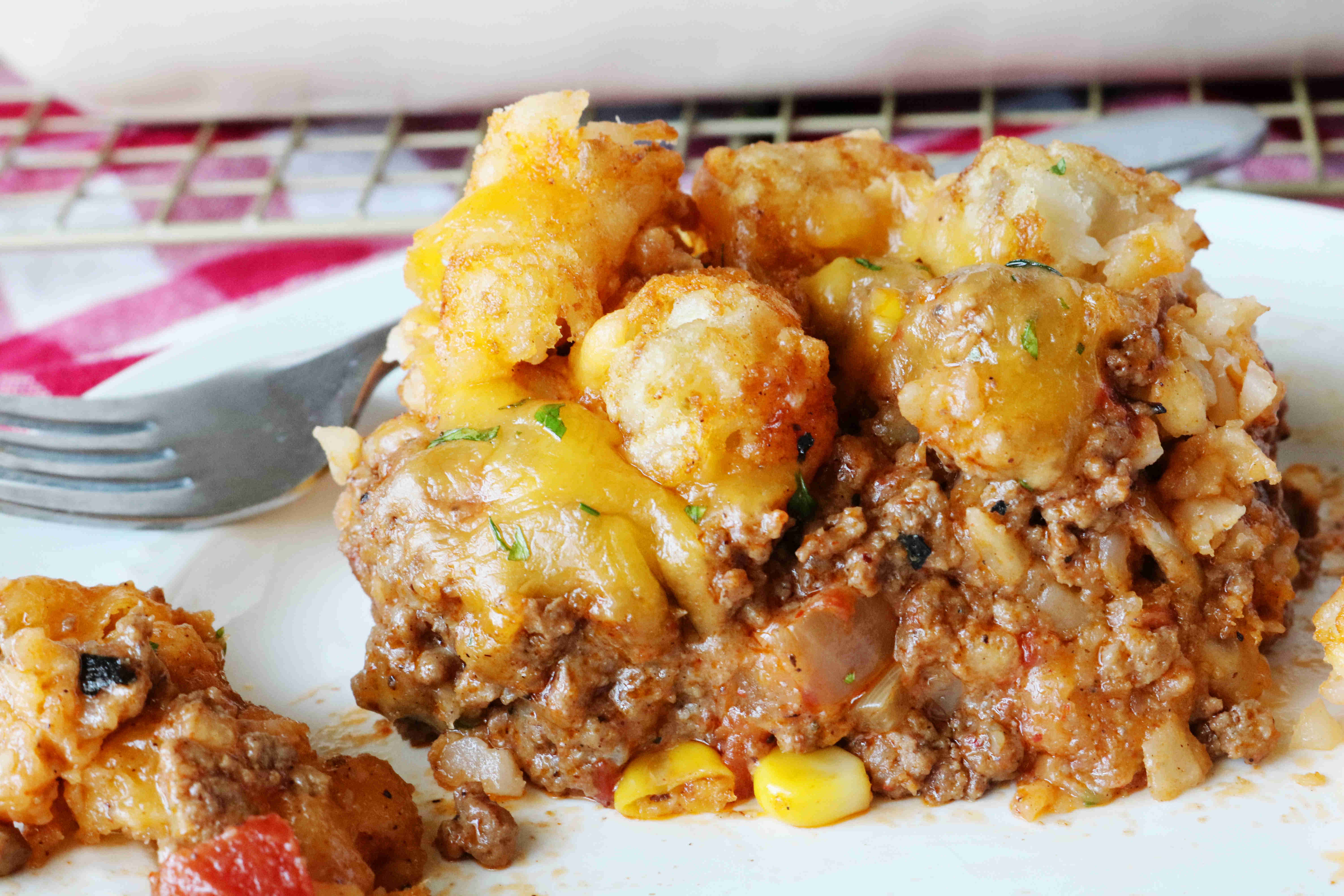 An easy Cowboy Casserole Recipe loaded ground beef, tater tots, and cheese!...