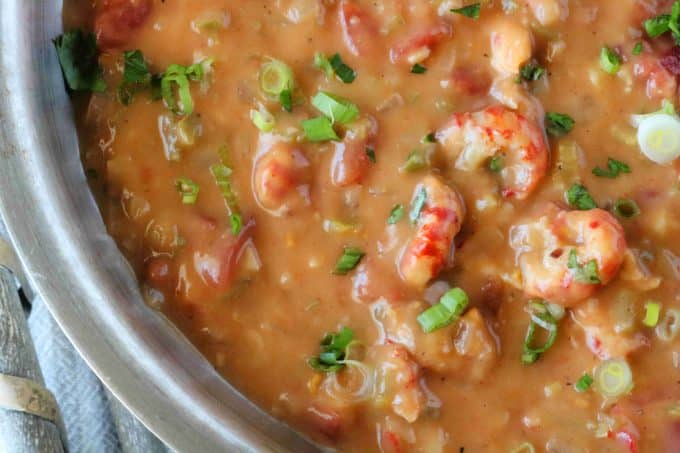 A close up overhead shot of Crawfish Etouffee in a skillet. 