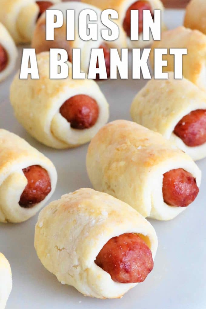 Image for Pinterest. Pigs in a blanket on a white plate.
