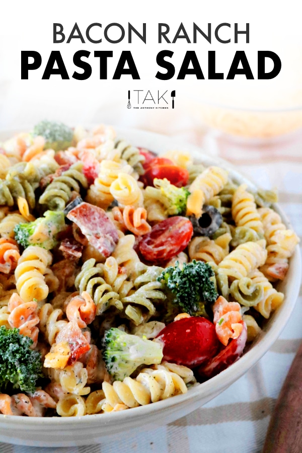 Image for Pinterest. Bacon ranch pasta salad in a bowl, sitting on top of a plaid towel.