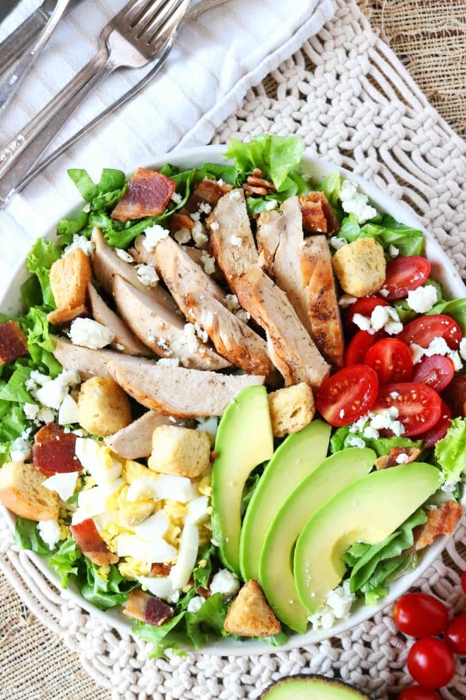 An overhead shot of Cobb Salad with sliced Chicken. 