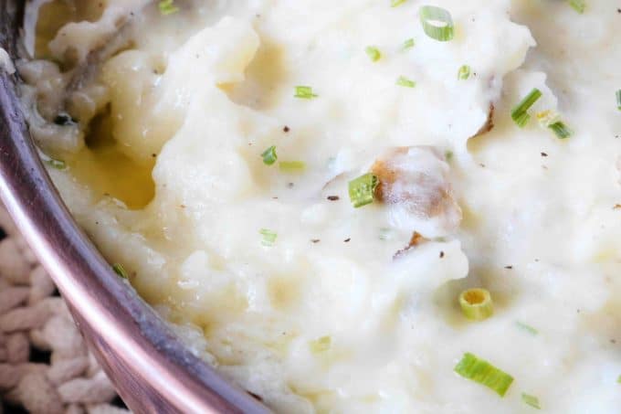 A close up shot of Mashed Potatoes with Skin. 