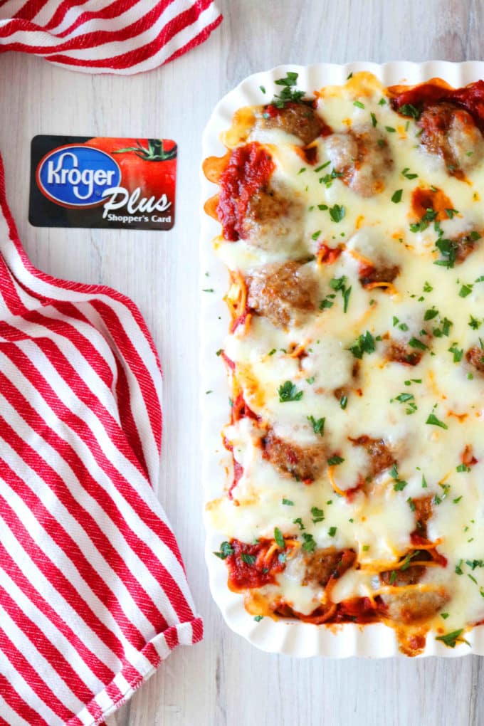 An overhead shot of Meatball casserole with a Kroger Plus Shoppers Card lying next to the casserole. 