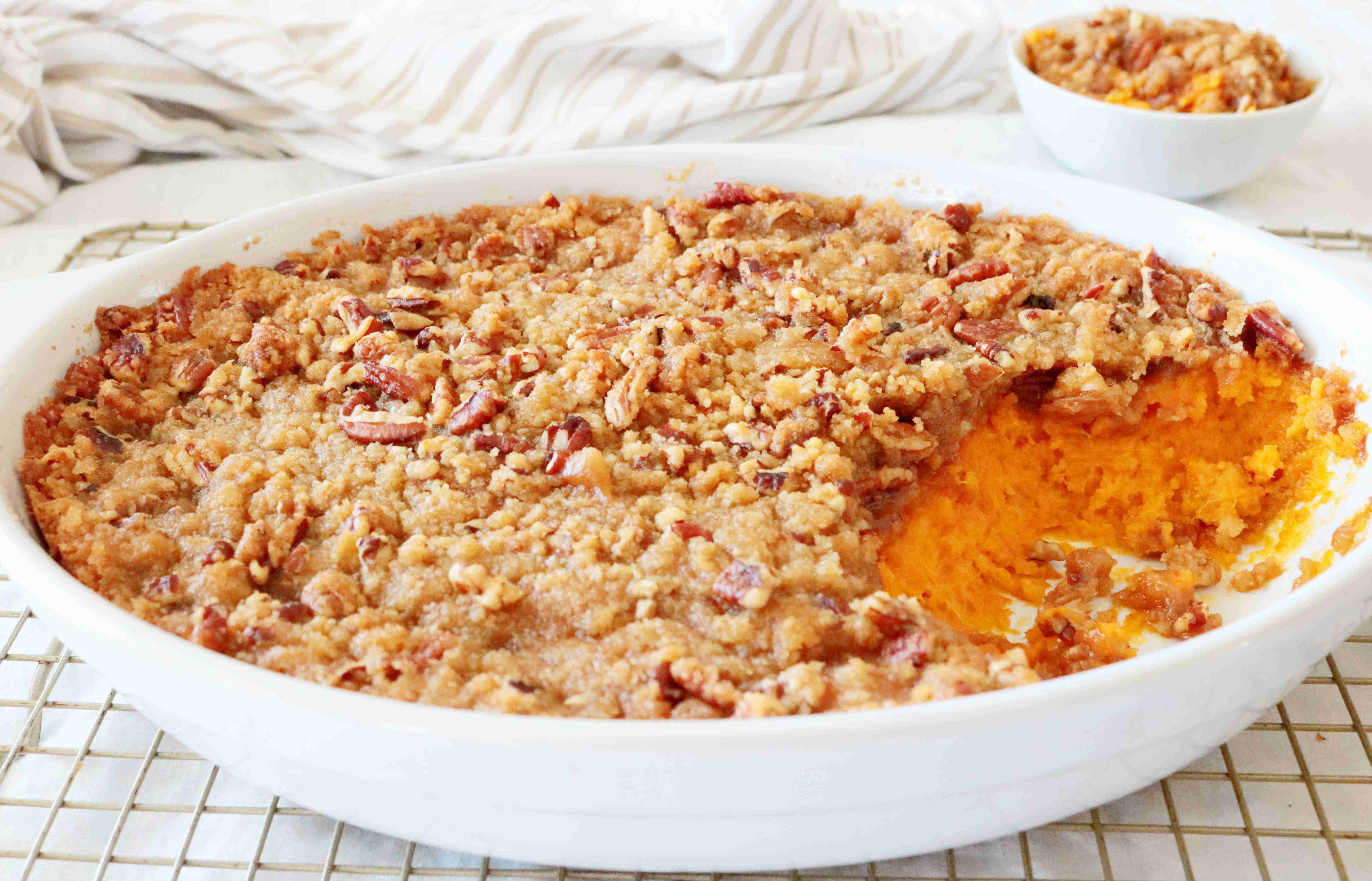 Sweet Potato Souffle with a rich and creamy sweet potato base and a crunchy...