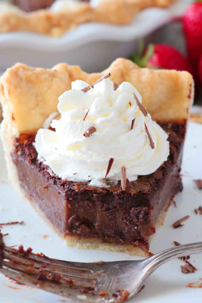 A close up shot of a slice of Chocolate Chess Pie with a bite missing. 