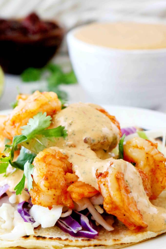 Shrimp taco topped with Chipotle sauce.
