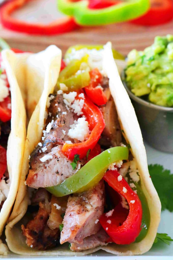 Chicken Fajita Tacos with bell pepper and cheese on top!