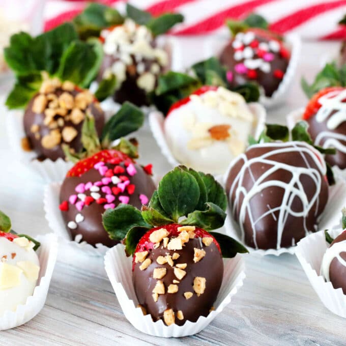 Chocolate-covered strawberries decorated with toffee, sprinkles, and nuts.