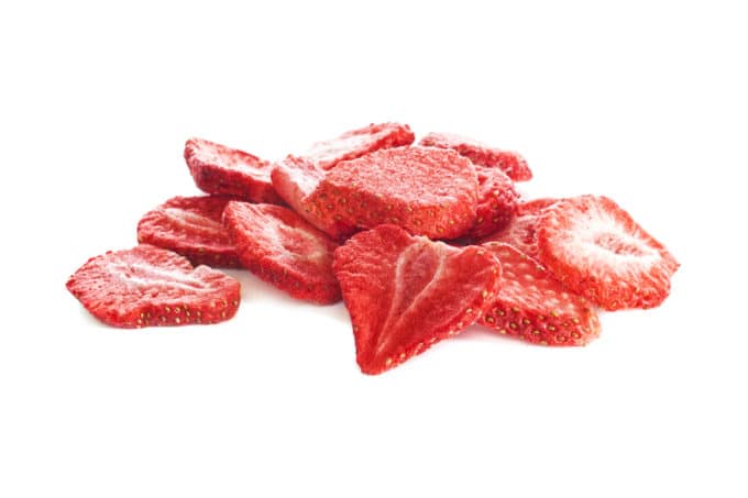 Freeze Dried Strawberry Slices - isolated on white with soft natural shadow.