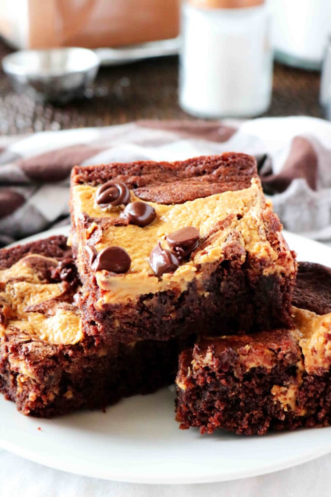 A stack of peanut butter brownies on a plate.