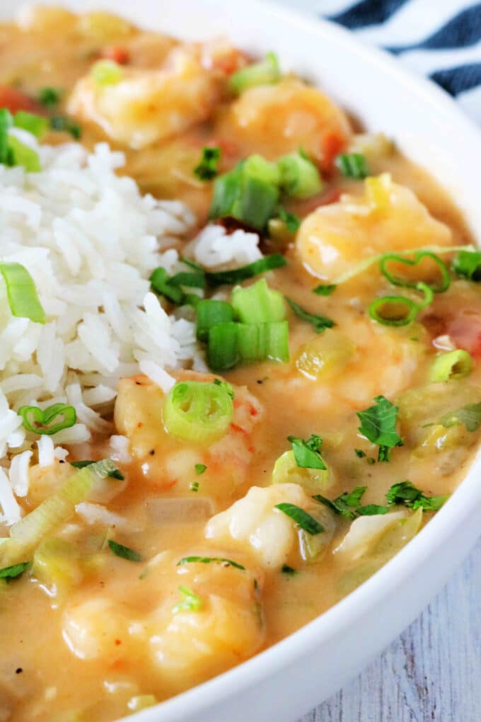 A close up shot of etouffee loaded with shrimp.