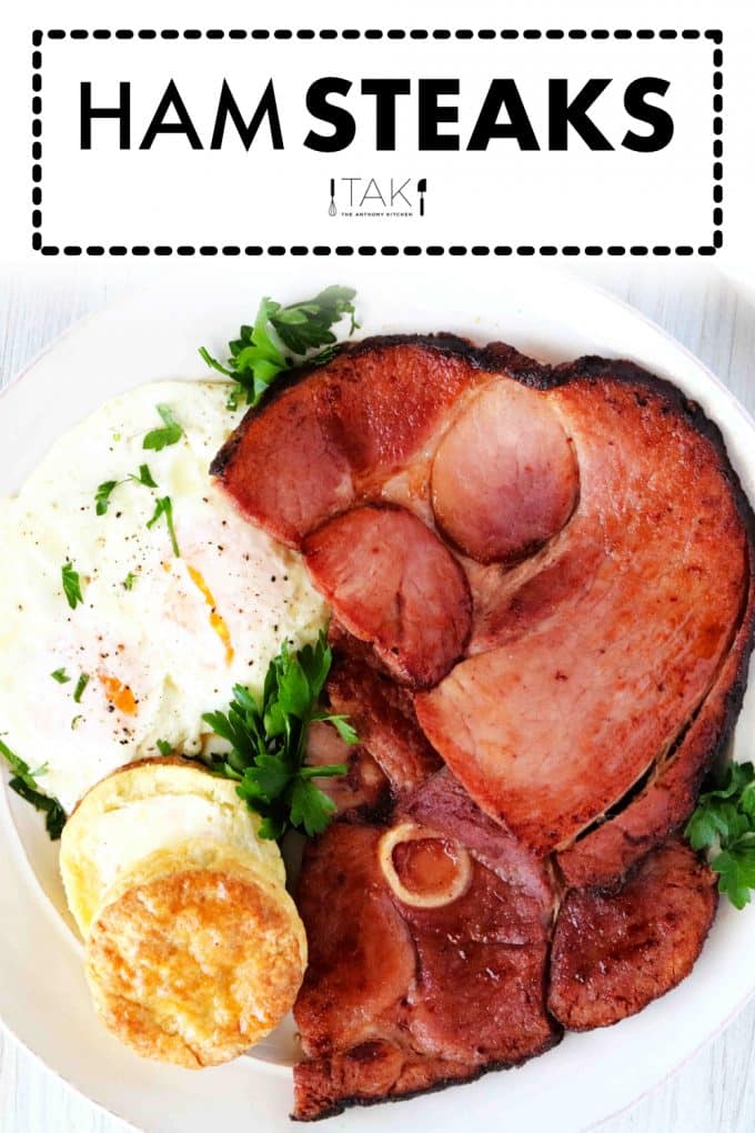 Image for Pinterest. Ham steak on a white plate with a fried egg and a biscuit on the side.