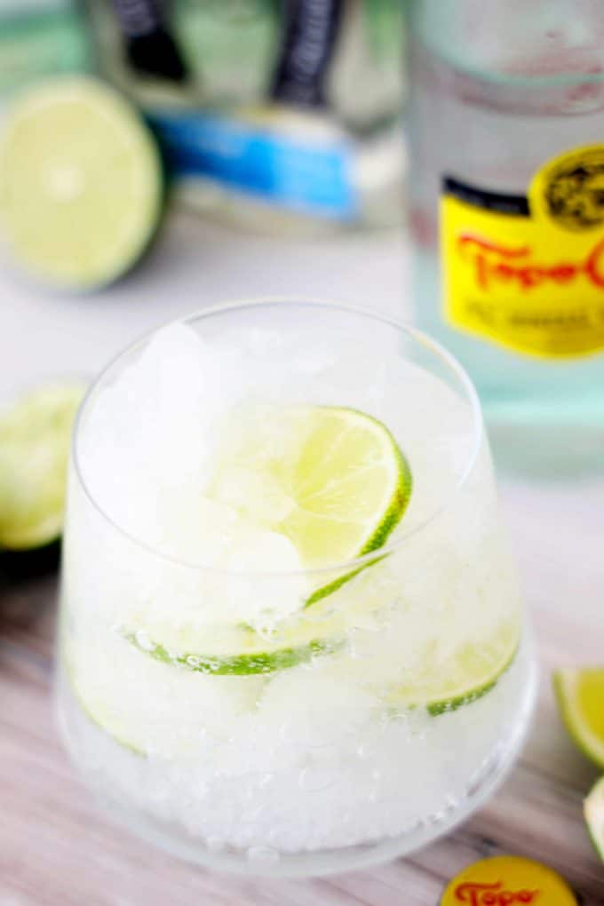Ranch Water Cocktail in a glass with ice, limes, and topo chico.