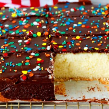 Yellow Cake with Chocolate Frosting that has been cut into slices.