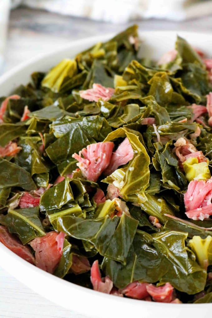 A close up shot of Southern Collard Greens with shredded ham hock.