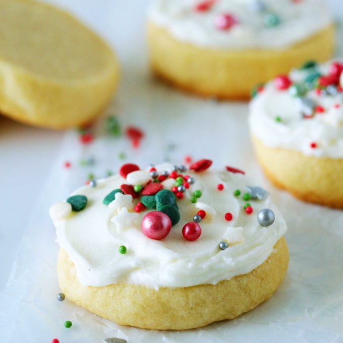 Soft Sugar Cookies with frosting and Christmas sprinkles.