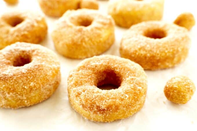 Cinnamon sugar air fryer donuts on a white surface.