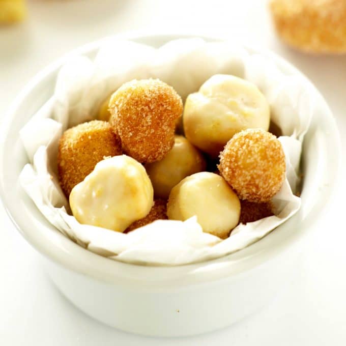 Air fryer donut holes in a white bowl.