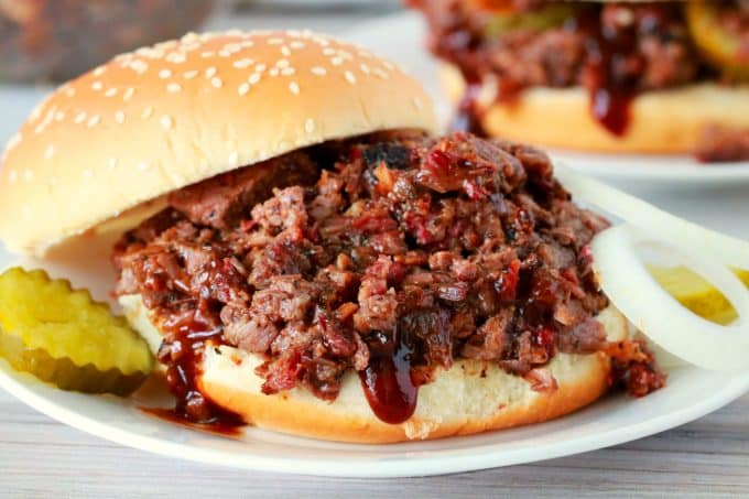 A Chopped Beef Brisket Sandwich with the top bun off to the side.