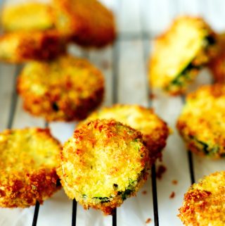 Air fryer zucchini chips on a cooling rack.