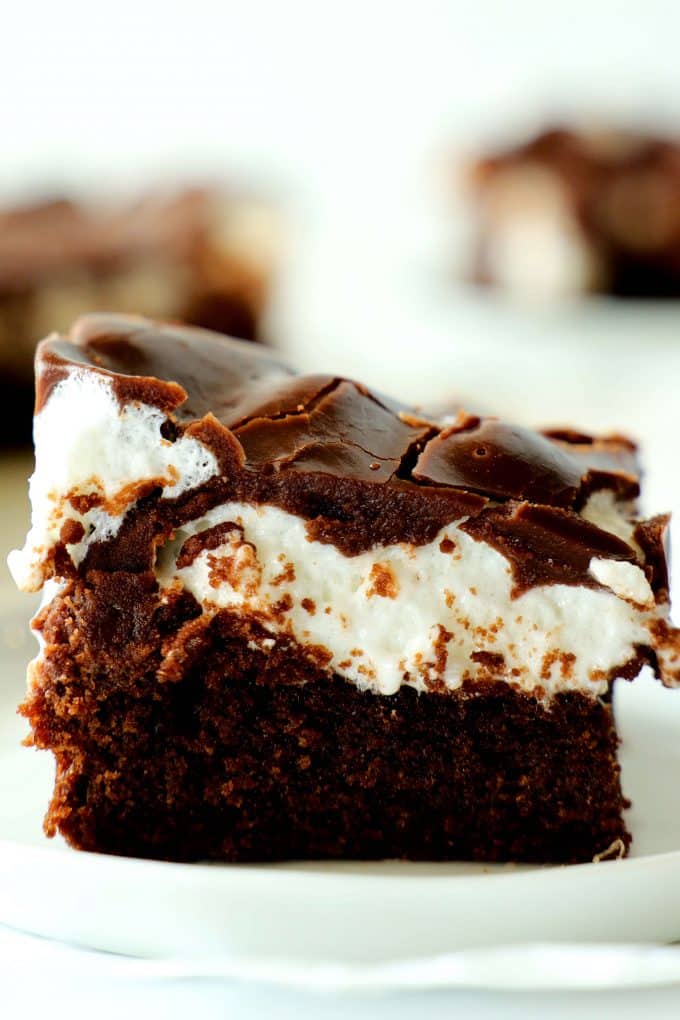 A marshmallow brownie on a white plate.