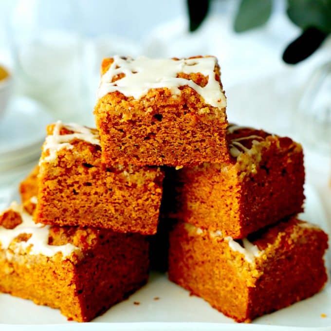 A stack of pumpkin coffee cake slices and a pyramid shape.