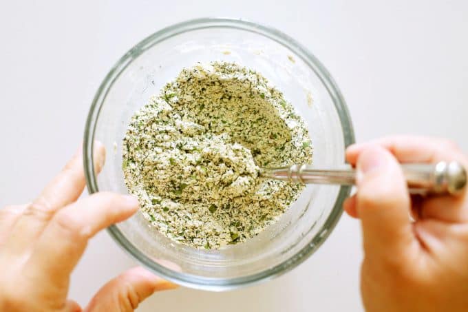 Buttermilk ranch dressing mix in a bowl being stirred together.