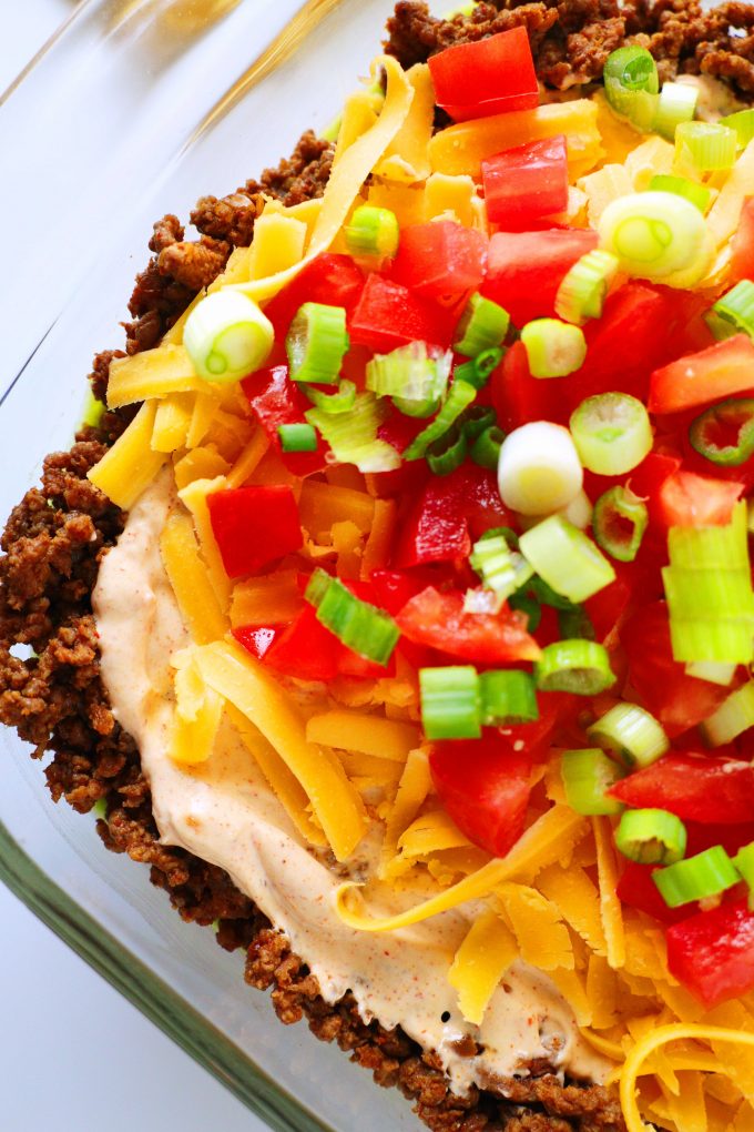 A close up overhead shot of seven layer taco dip.