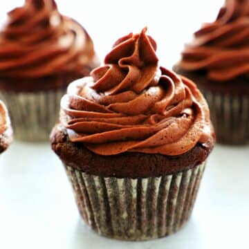 Easy Chocolate Cupcakes from scratch on a white surface.