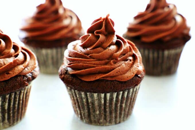 Easy Chocolate Cupcakes from scratch on a white surface. 