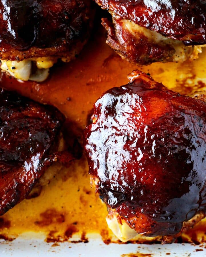 Barbecue chicken thighs in a casserole dish.