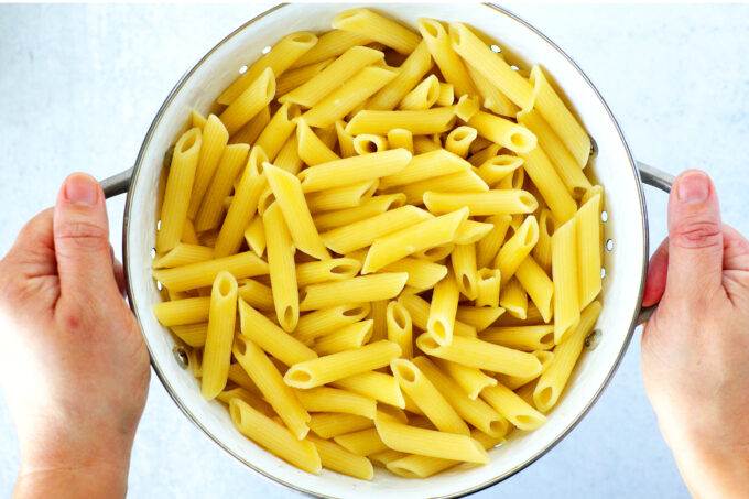 Cooked pasta in a colander 