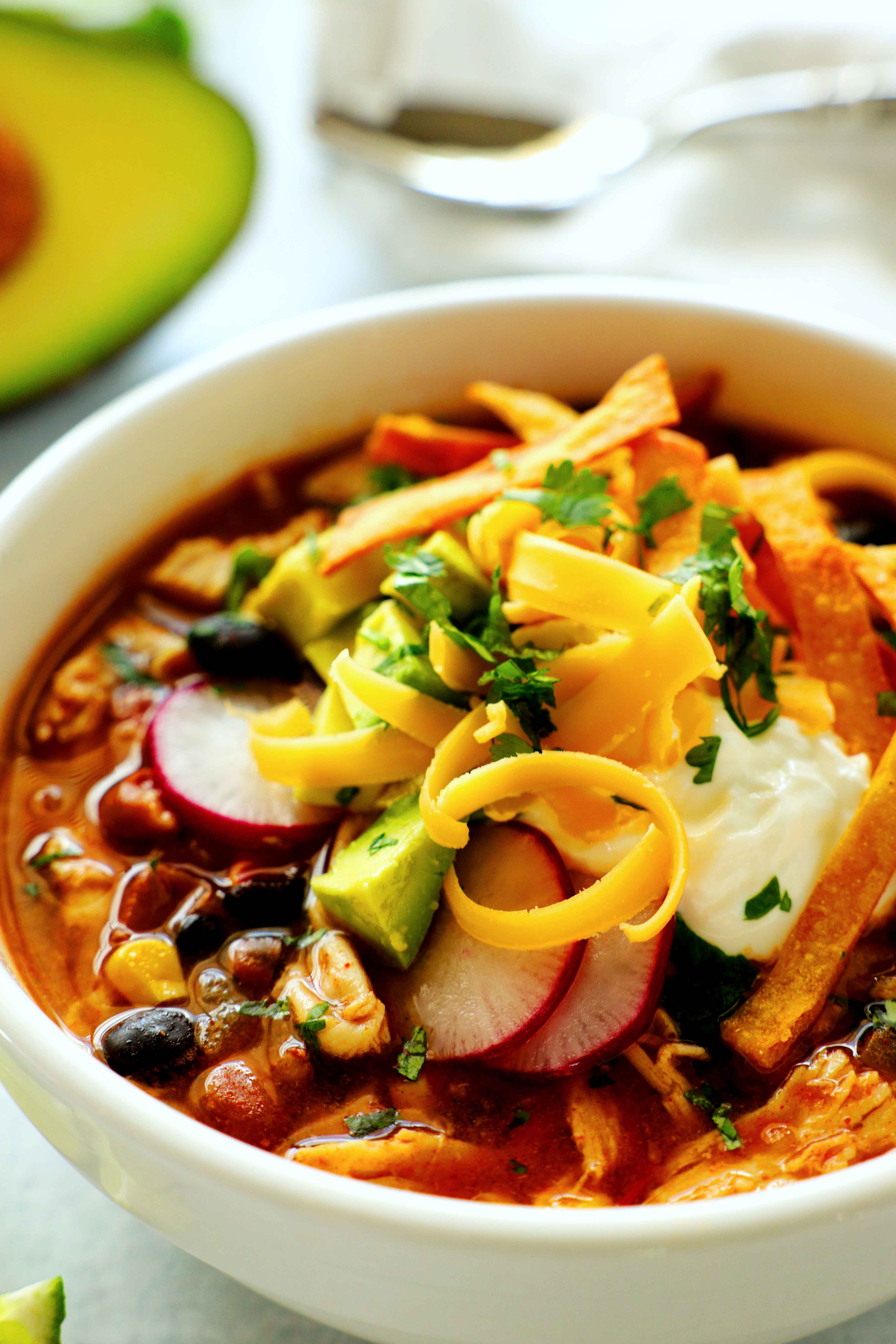 Closeup of chicken taco soup with toppings