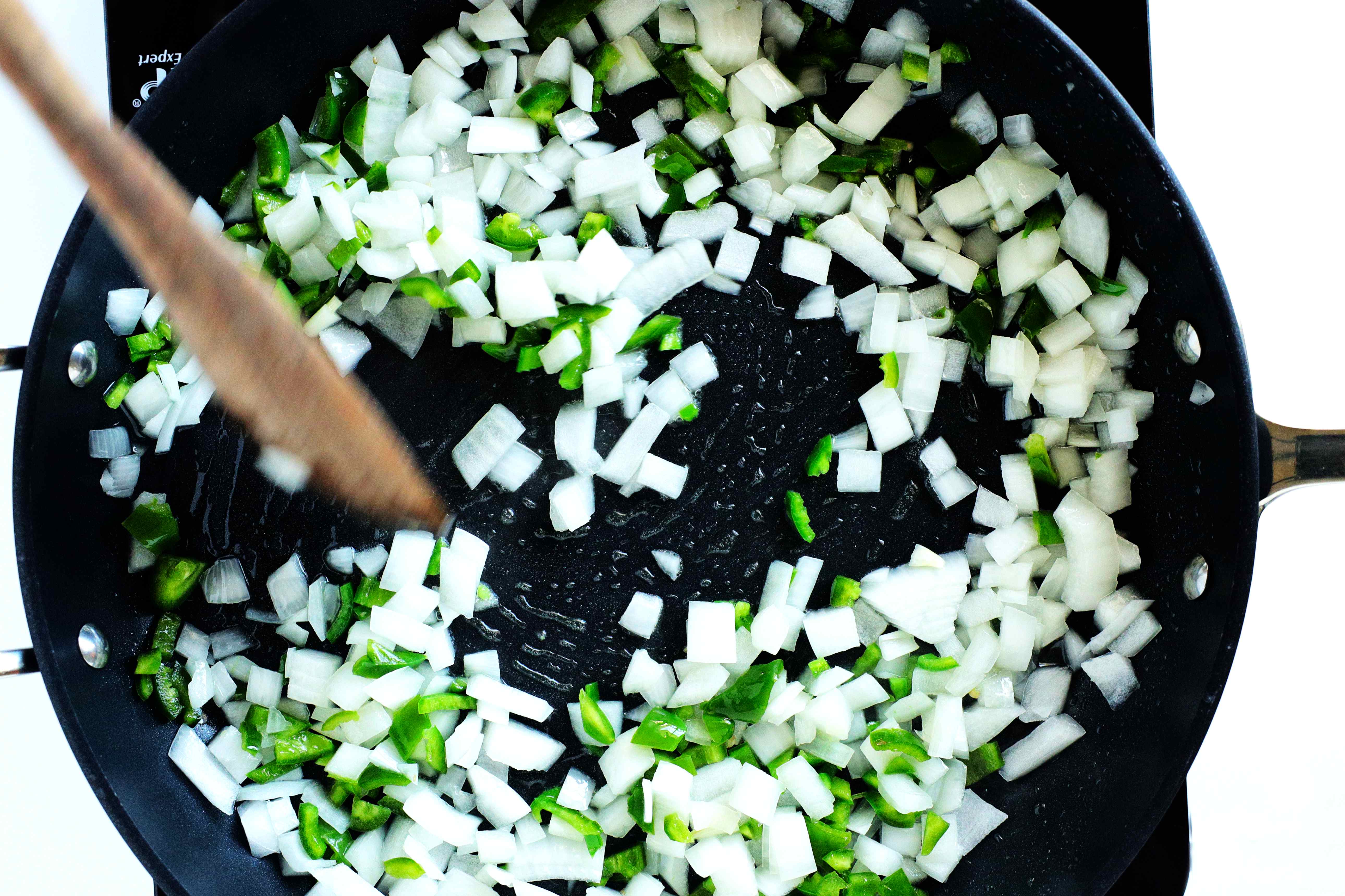 diced jalapeños and onions in a pan