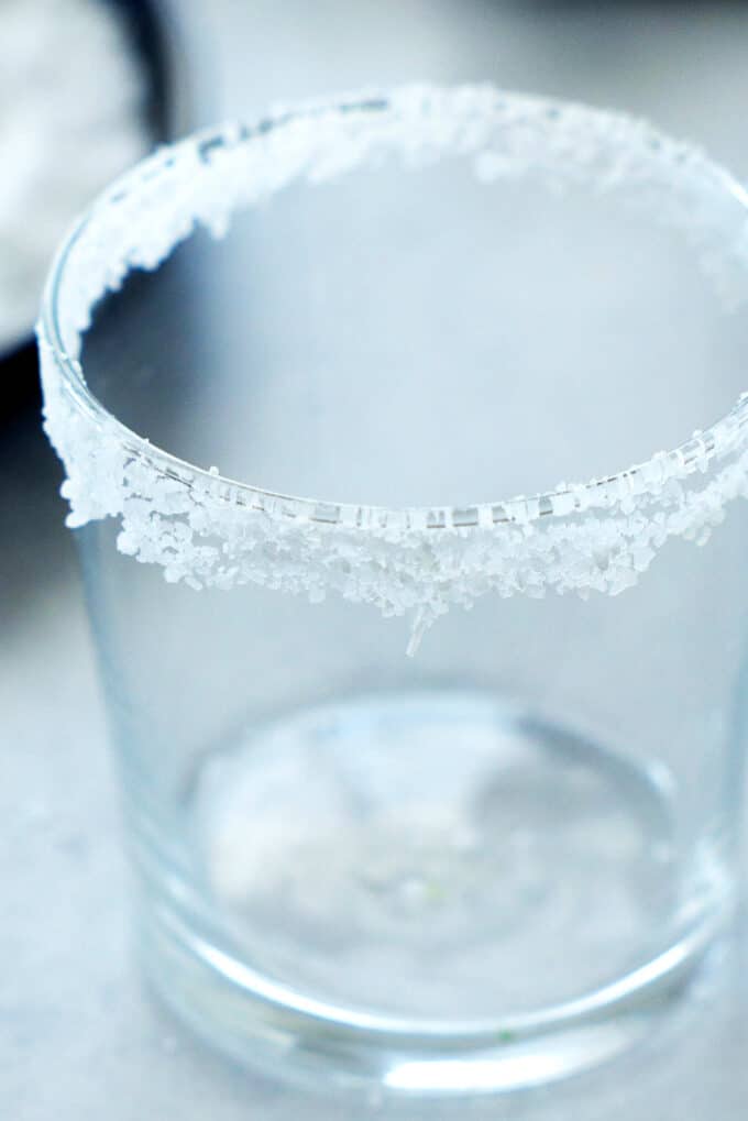an empty glass with salt around the rim
