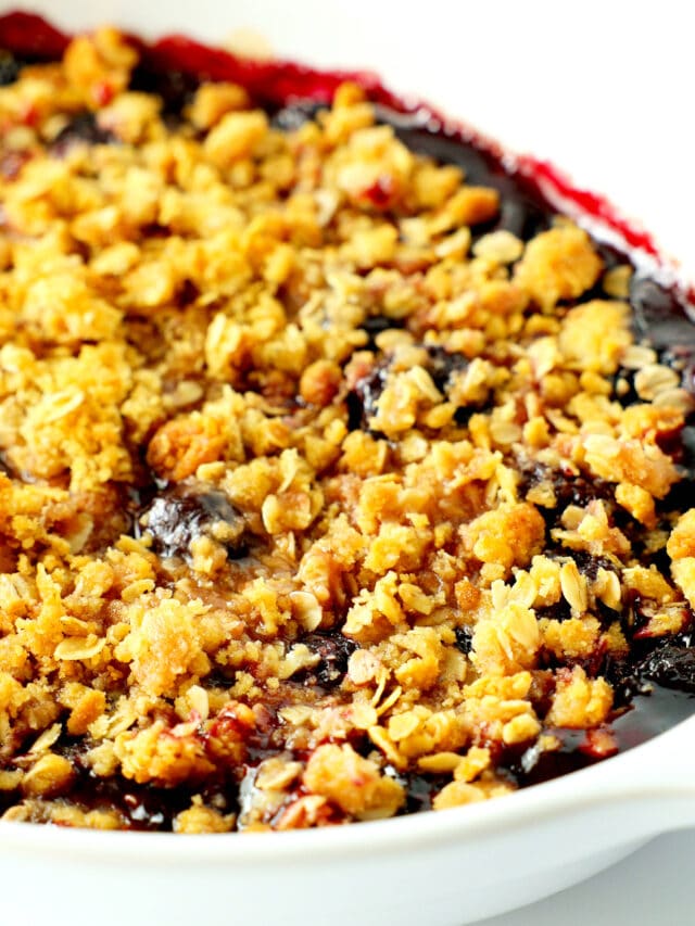 a close up of cherry crisp still in the baking dish