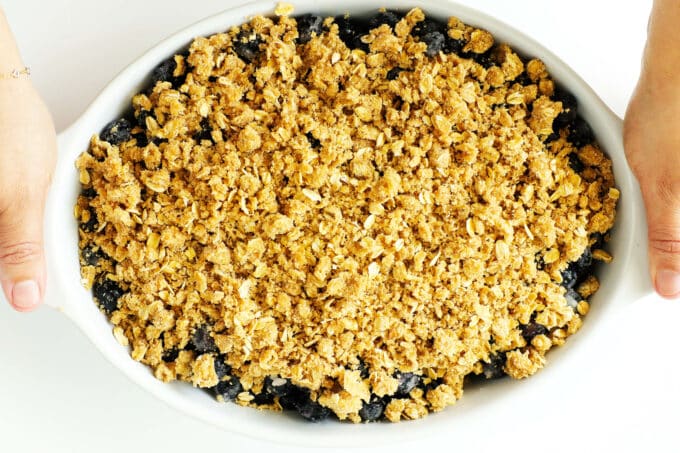 And overhead shot of an uncooked blueberry crisp turn 