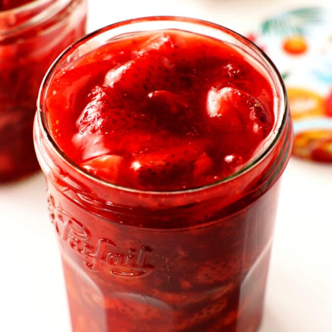 A close up of Strawberry Compote in a jar