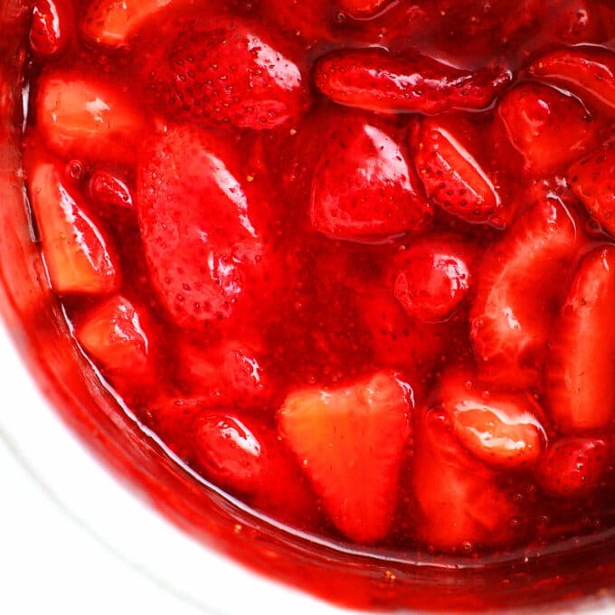a close up of strawberry compote in a bowl