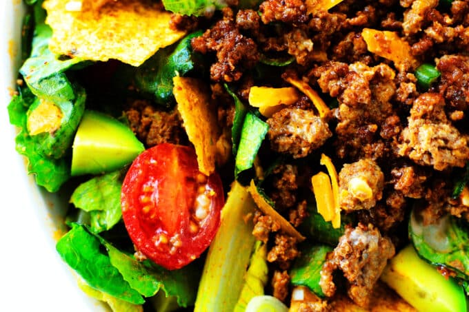A close up of ground beef on a taco salad