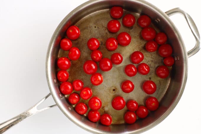 overhead view of tomatoes in a saucepan 