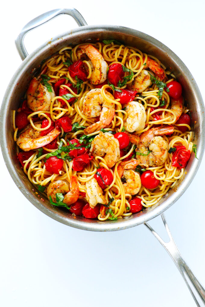 An overhead view of shrimp spaghetti in a saucepan 